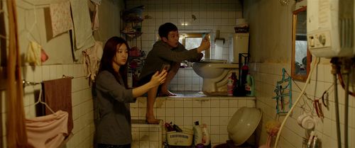 Choi Woo-sik and Park So-dam in Parasite (2019)