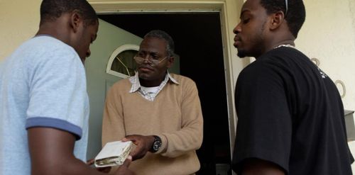 Mr. Livingston hands Bible to Edson