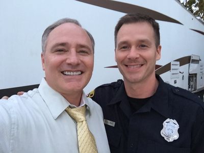 HOLDING PATTERNS (2016) Gary Ray Moore (Ross) and Jody Mullins (Police Officer).