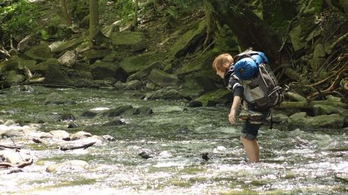 Crossing river on set of Never Go Back