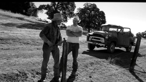 Perry King as Sam Kincaid and Bryan Kaplan as Luke Higgins in The Divide.