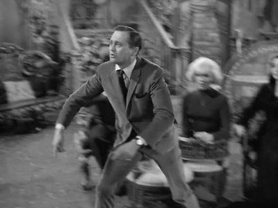 John Astin, Carolyn Jones, Laurie Mitchell, and Herkie Styles in The Addams Family (1964)