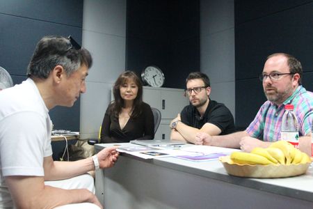 Jackie Chan discusses his character of Mr. Feng with Bob Barlen and Cal Brunker at China Film Studios in Beijing.