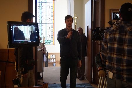Aquarians director Michael M. McGuire sets the framing of a shot.