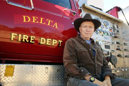 Leo with Bigger Red -- one of his four fully operational fire engines. 