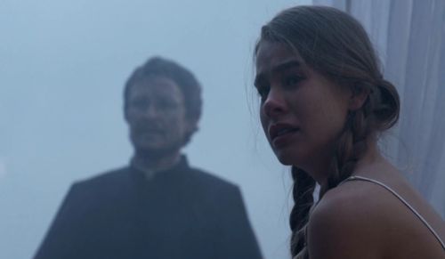 Damon Herriman and Asha Boswarva in Lambs of God (2019)