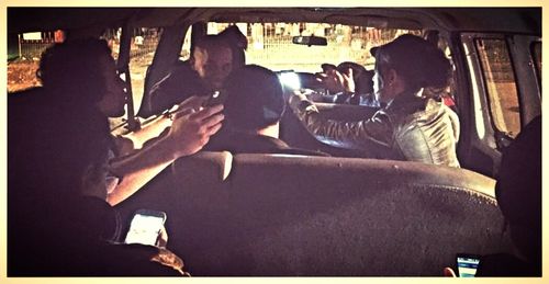 Elizabeth and Robin cracking jokes while try stay warm in between set ups in the van.