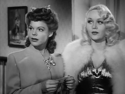 Marion Martin and Frances E. Neal in Powder Town (1942)