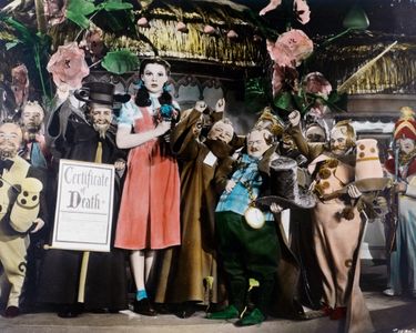 Judy Garland, Charles Becker, and Meinhardt Raabe in The Wizard of Oz (1939)