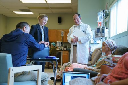 Susan Moore Harmon, Amanda Seyfried, James Hiroyuki Liao, and Mike Baker in The Dropout (2022)
