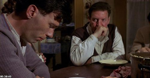 Declan Croghan and Ray McAnally in My Left Foot (1989)