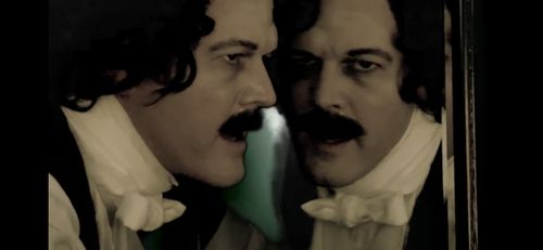 As Edgar Allan Poe in The Raven