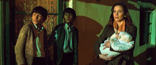 Gyöngyvér Bognár, László Gyémánt, and András Gyémánt in The Notebook (2013)
