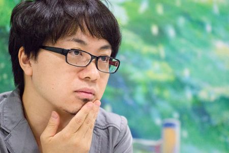 Makoto Shinkai at an event for The Garden of Words (2013)