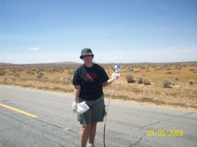 Co-Producer/SFX Coordinator, Gigi Bannister, prepares pumper sphere rig on location for Phantasm V: Ravager.