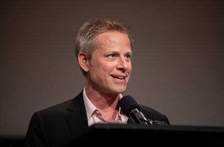 Series creator Aaron Cooley accepting a 2022 Norman Lear Center Sentinel Award on behalf of The First Lady for its depic