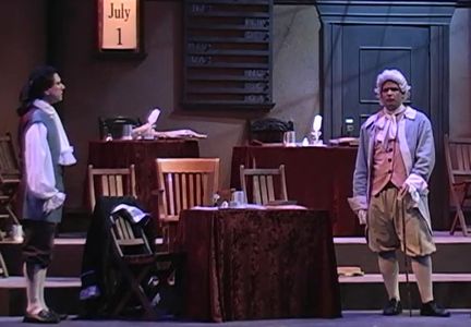 Peter Tedeschi, far left, as John Adams in 1776 as Adams confers with Dr. Lyman Hall.