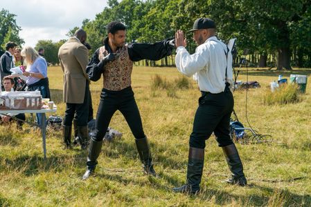 Regé-Jean Page and Sofian Francis in Bridgerton (2020)