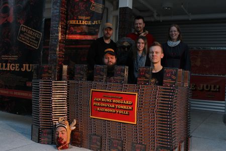 Some of the cast and crew, in a castle made of 