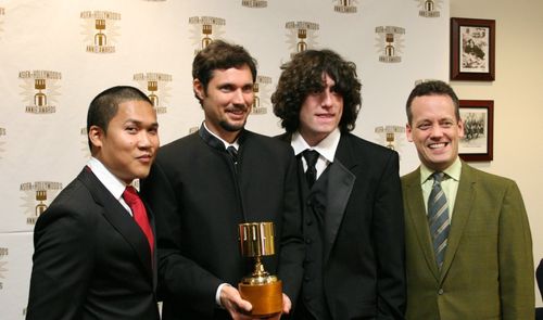 Dante Basco (l),Jack De Sena (3rd from l),Dee Bradley Baker (r) present the Production Artist award to John Clark.