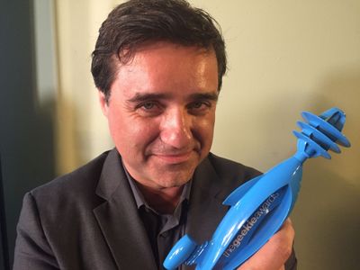 Writer Director Christian Gossett holding his first GEEKIE award, won for co-writing and directing the geekiest fan film