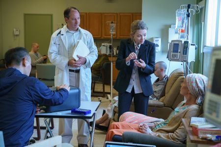 Susan Moore Harmon, Amanda Seyfried, James Hiroyuki Liao, and Mike Baker in The Dropout (2022)