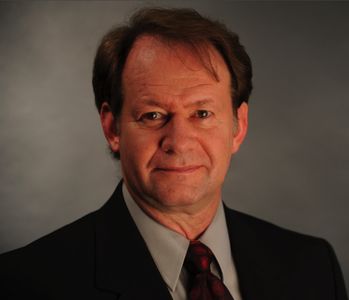 Current headshot as of mid 2011. Business suit look.