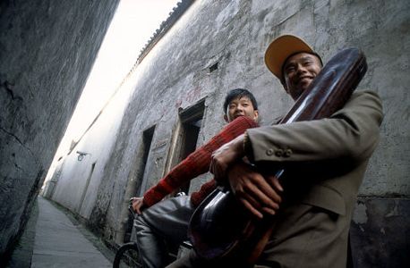 Peiqi Liu and Yun Tang in Together with You (2002)