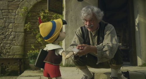 Tom Hanks and Benjamin Evan Ainsworth in Pinocchio (2022)
