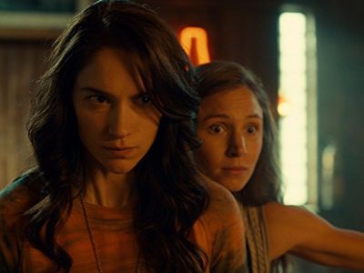 Melanie Scrofano and Dominique Provost-Chalkley in Wynonna Earp (2016)