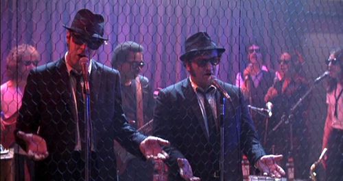 John Belushi, Dan Aykroyd, Donald Dunn, Tom Malone, Lou Marini, Matt Murphy, and Alan Rubin in The Blues Brothers (1980)