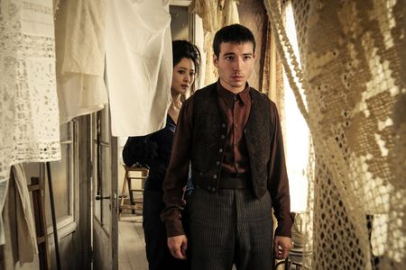 Claudia Kim and Ezra Miller in Fantastic Beasts: The Crimes of Grindelwald (2018)
