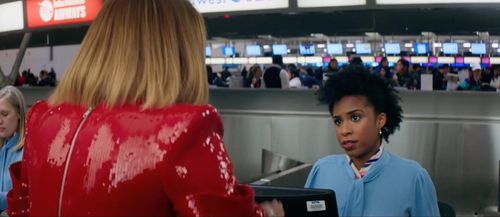 Kara F. Green as ticket agent in 