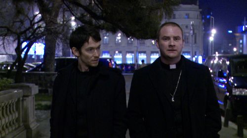 Simon Quarterman and Evan Helmuth in The Devil Inside (2012)