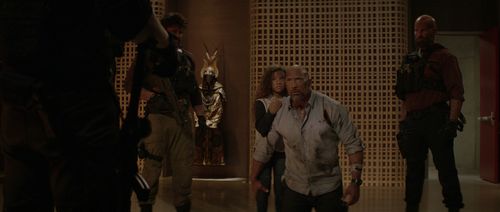 Dwayne Johnson, Jason William Day, and McKenna Roberts in Skyscraper (2018)