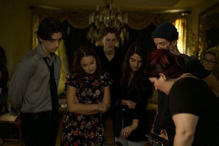 Jaclyn Jasgur (director) reviewing takes with cast/crew