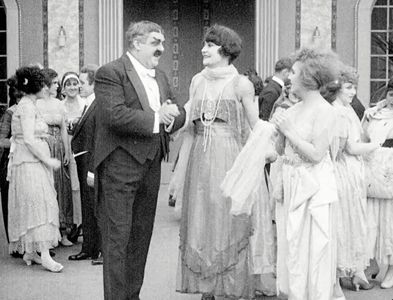 Eric Campbell, Charlotte Mineau, and Edna Purviance in The Rink (1916)