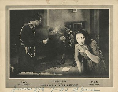 Earl Metcalfe, Gina Relly, and Edward Roseman in The Face at Your Window (1920)