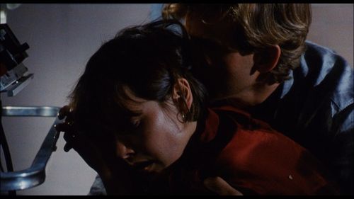 Carey Lowell and Dwier Brown in The Guardian (1990)