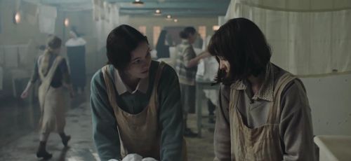 Abby Fitz and Ciara Stell in The Woman in the Wall (2023)