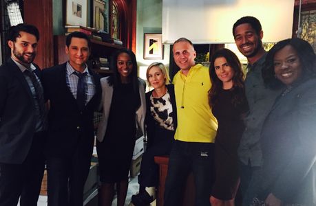 With the cast of 