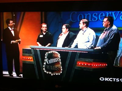 Dan hosts the game show sequence from Lord, Save Us.