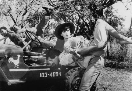 Erick Bowen, Lena Farugia, Hans Strydom, and Treasure Tshabalala in The Gods Must Be Crazy II (1989)
