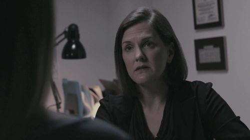 Erin Bradley Dangar as Detective Amy Moore in Murder Comes to Town, 