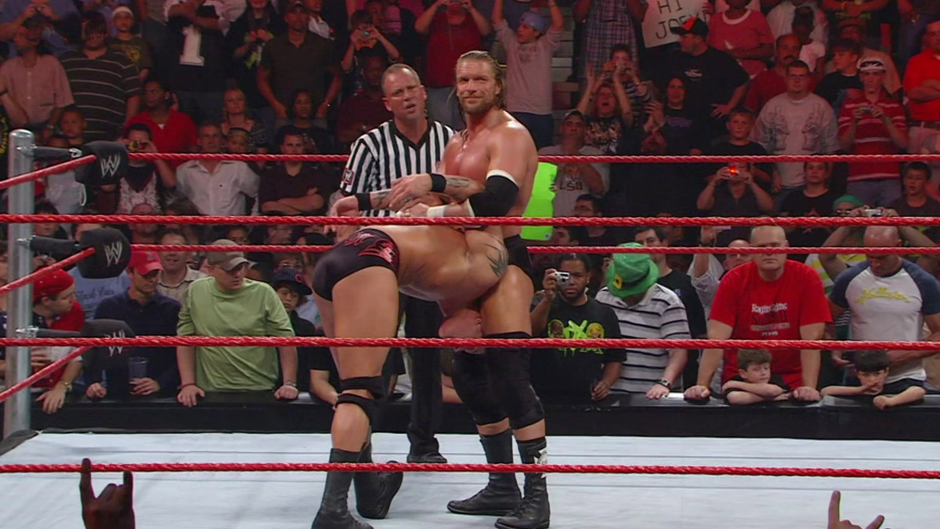 The 50 Greatest Finishing Moves in WWE History background