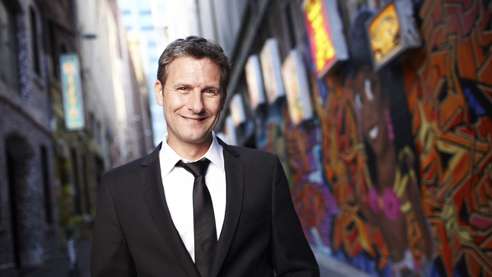Adam Hills in Gordon St Tonight background