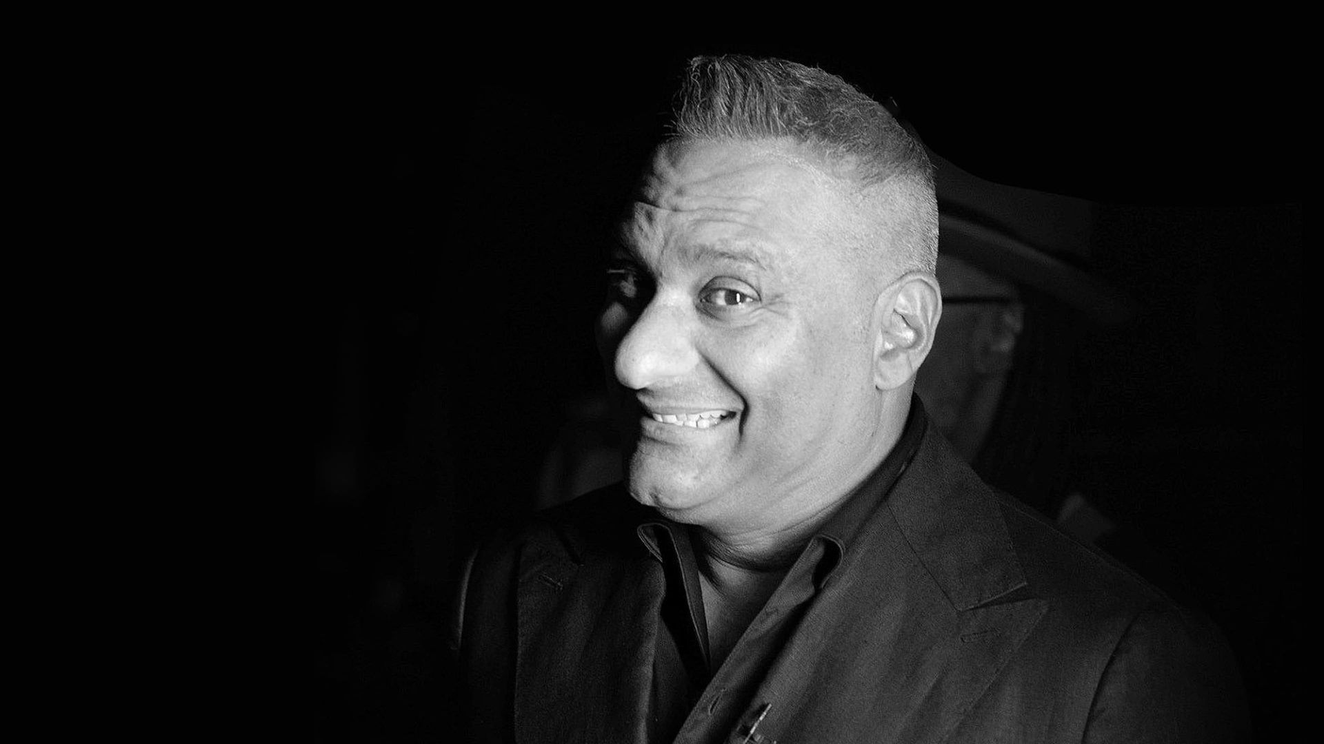 Russell Peters: Irresponsible Ensemble background